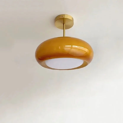 Elegant loftlampe med orange glasskærm i vintage stil