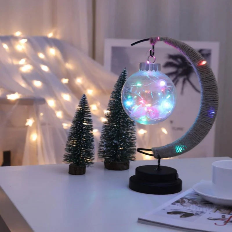 Stemningsfuld LED-bordlampe med glaskugle og halvmåne