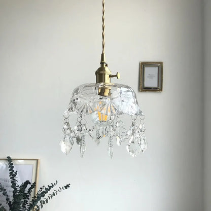 Retro pendellampe i krystalklart glas med messingfinish