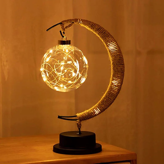Stemningsfuld LED-bordlampe med glaskugle og halvmåne