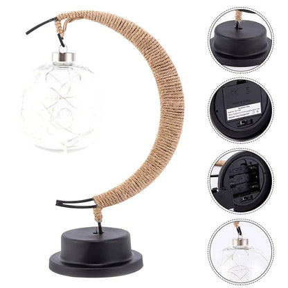 Stemningsfuld LED-bordlampe med glaskugle og halvmåne