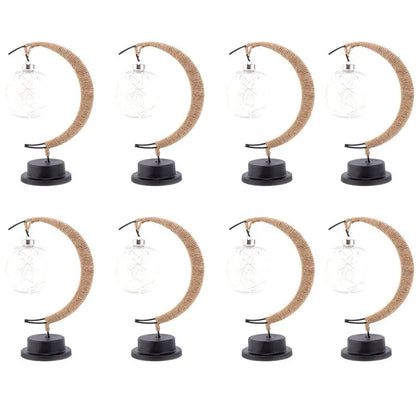 Stemningsfuld LED-bordlampe med glaskugle og halvmåne