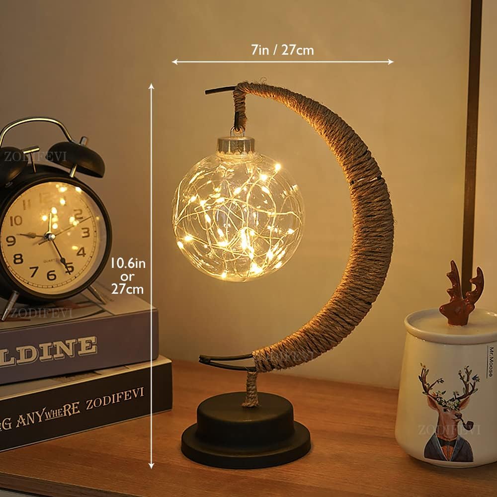 Stemningsfuld LED-bordlampe med glaskugle og halvmåne