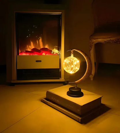 Stemningsfuld LED-bordlampe med glaskugle og halvmåne