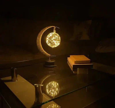 Stemningsfuld LED-bordlampe med glaskugle og halvmåne