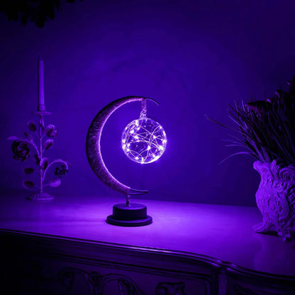 Stemningsfuld LED-bordlampe med glaskugle og halvmåne