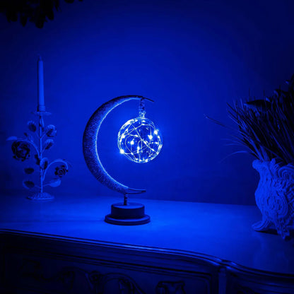 Stemningsfuld LED-bordlampe med glaskugle og halvmåne