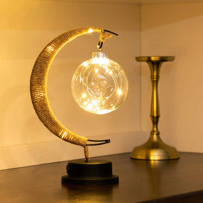 Stemningsfuld LED-bordlampe med glaskugle og halvmåne
