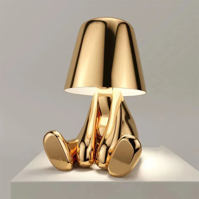 Designer LED bordlampe formet som en siddende figur med blank finish