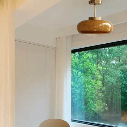 Elegant loftlampe med orange glasskærm i vintage stil