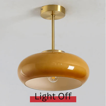 Elegant loftlampe med orange glasskærm i vintage stil