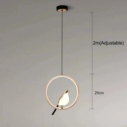 Pendellampe med gyldent fuglomotiv